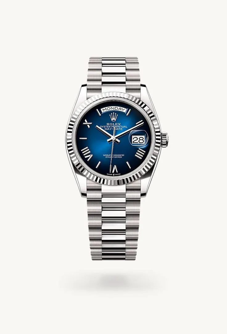 Rolex Day-Date 36 White Gold – Blue Ombré Dial with Roman Numerals https://yuplify.com